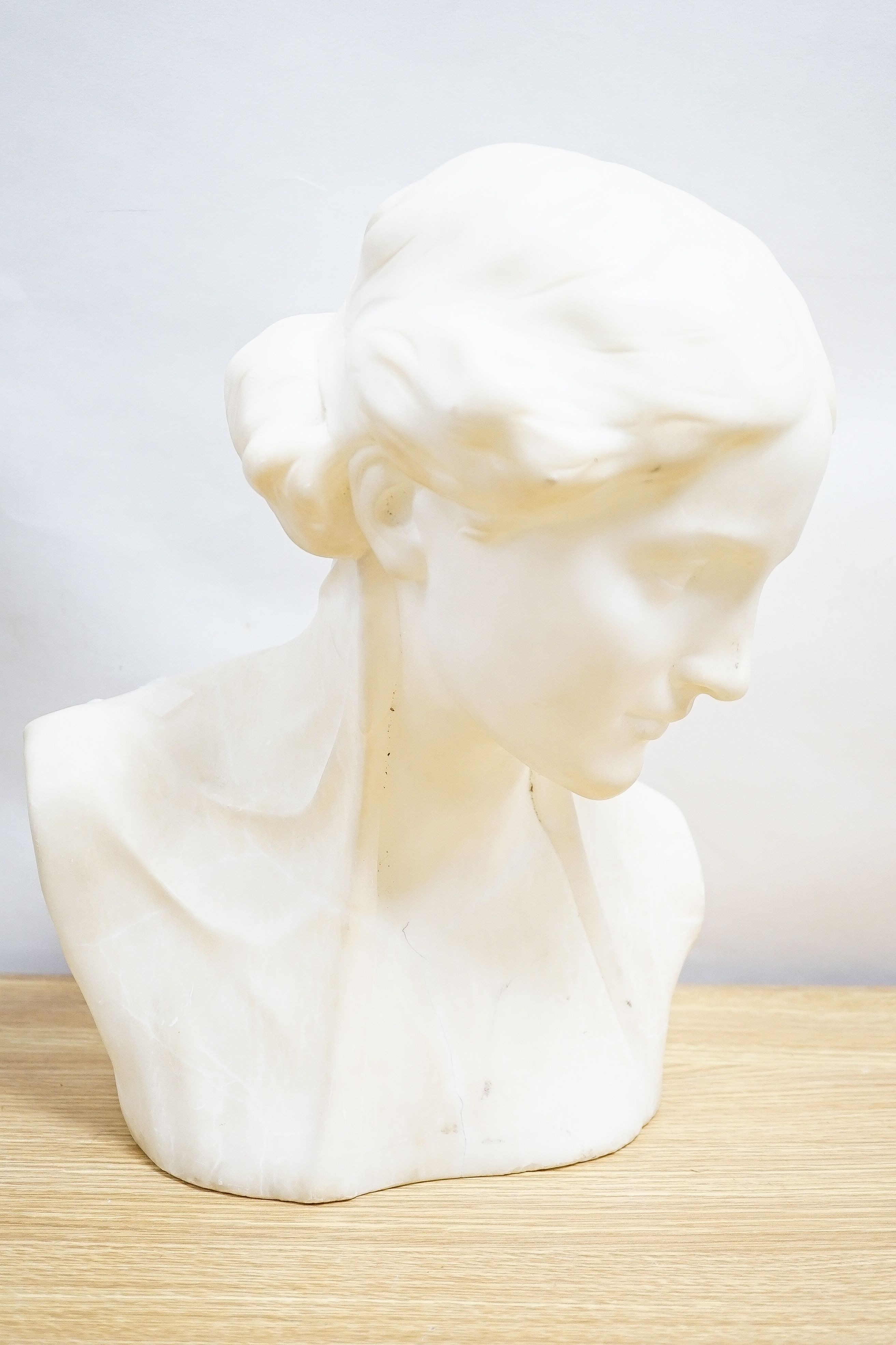 Valmore Gemignani, Italian 1879-1958, a carved alabaster bust of a lady, signed, 38cm